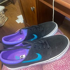 teal, purple, and black janoskis